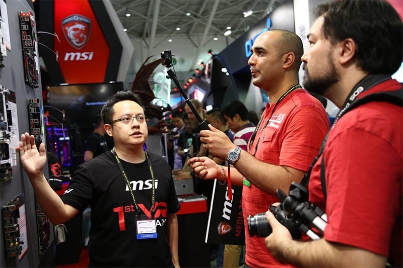 Who is that handsome gentleman being enthralled by MSI's Boards? 