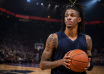 Ja Morant real name is Temetrius Jamel Morant, pictured holding a basketball in an arena