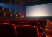 Illustration of an empty cinema with red seats and a glowing screen