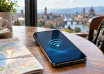 Smartphone showing a connectivity symbol beside a street map in a city cafe
