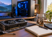 Graphics card, savings jar, calculator and notebook beside a gaming PC.