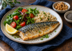 Cooked mackerel with rice, leafy salad and lemon, beside bowls of walnuts and chia seeds