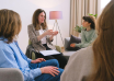 A therapist speaking with a small group during a counseling session